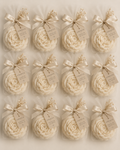 Ivory flower candles in organza bags with satin ribbon and CoreWick gift tags