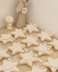 Star shaped candles with satin ribbon and personalized tags