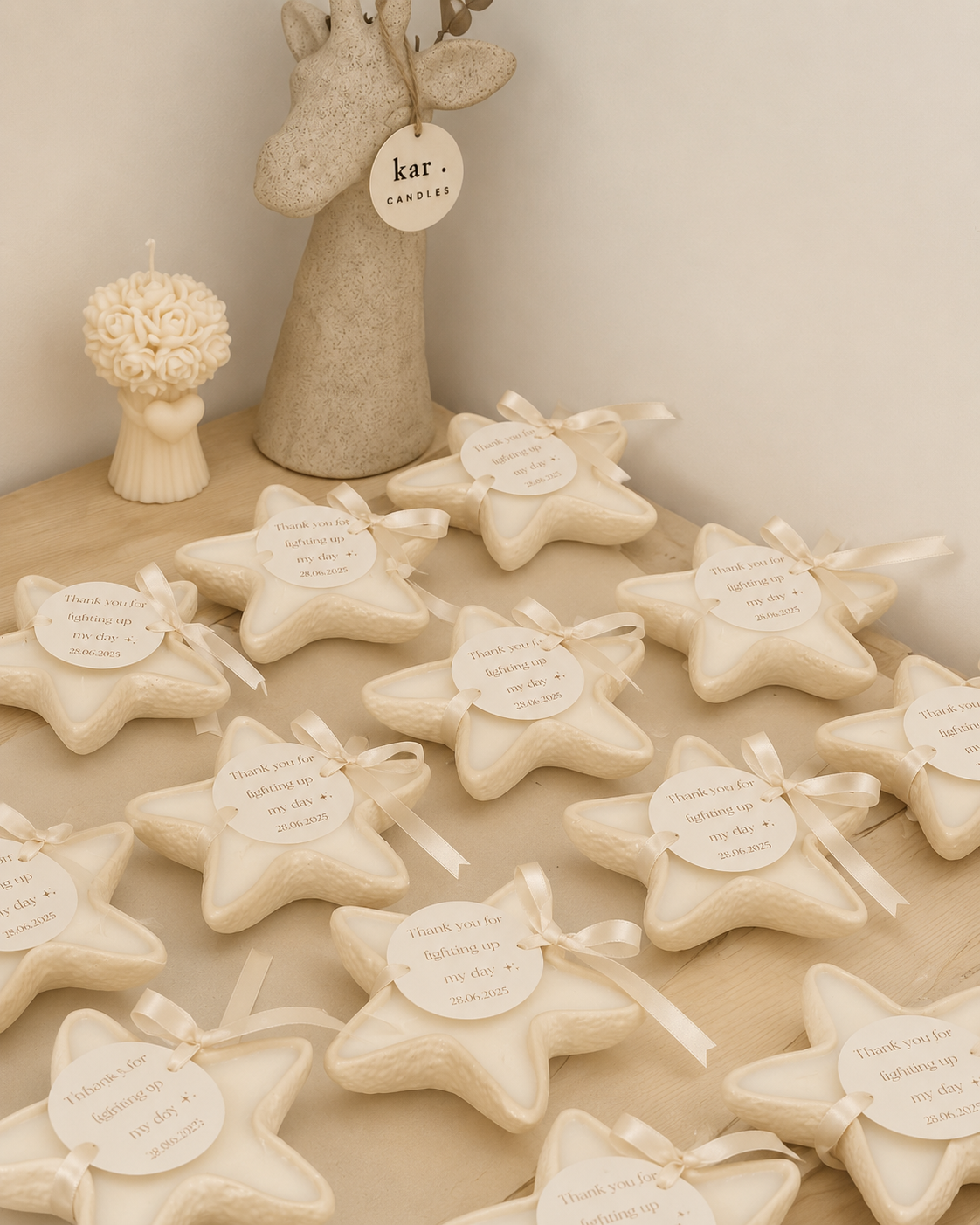 Star shaped candles with satin ribbon and personalized tags