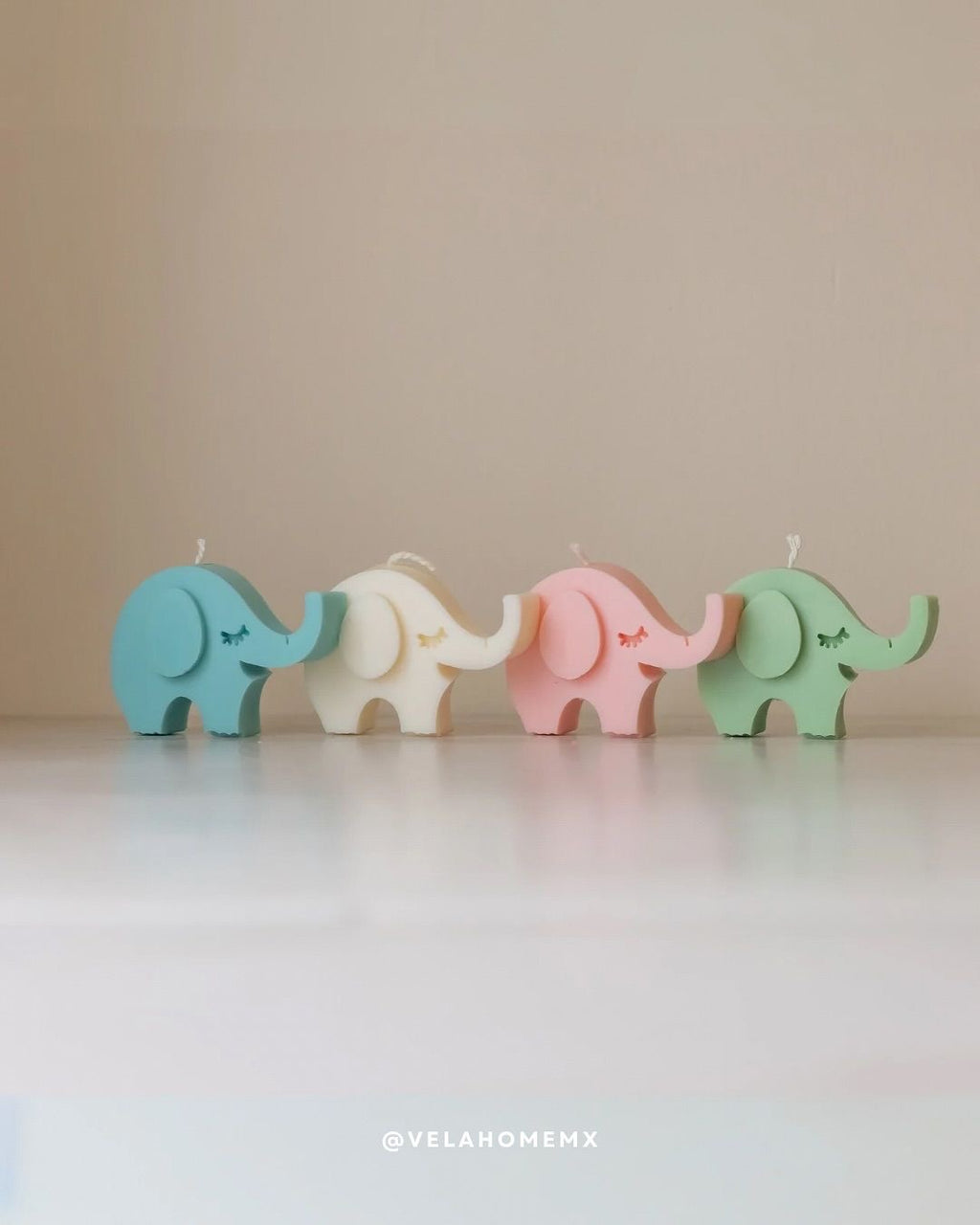 Elli elephant candles in pastel colors - blue, ivory, pink and green