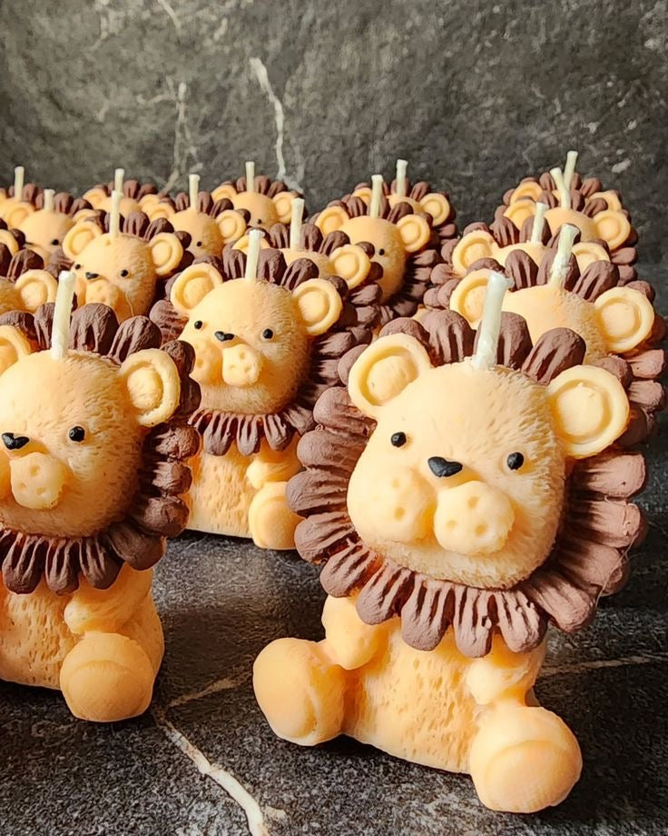 Multiple Leo candles in golden tones displayed together